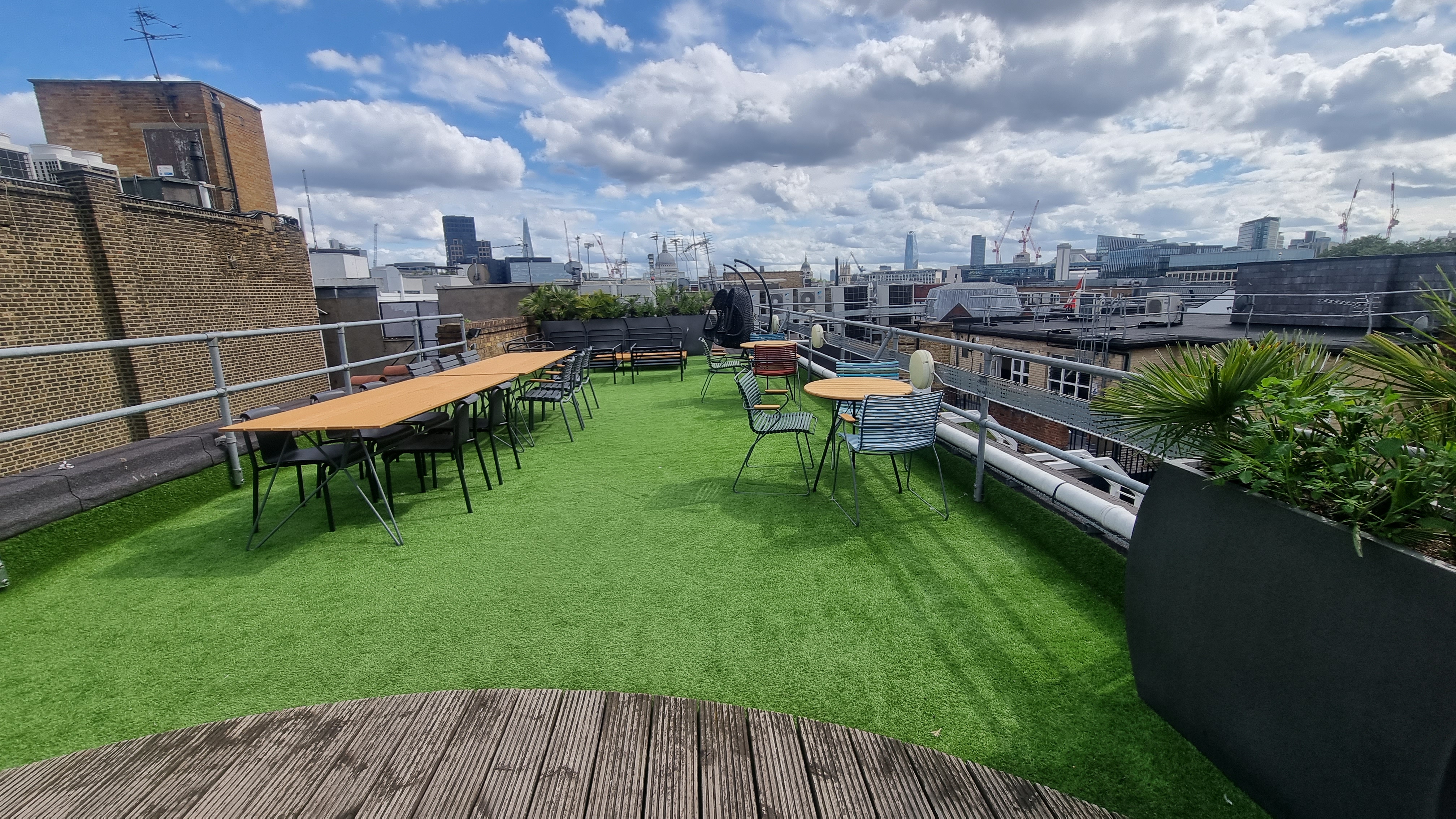 Rooftop event space in Clerkenwell with green turf, ideal for summer meetings and gatherings.