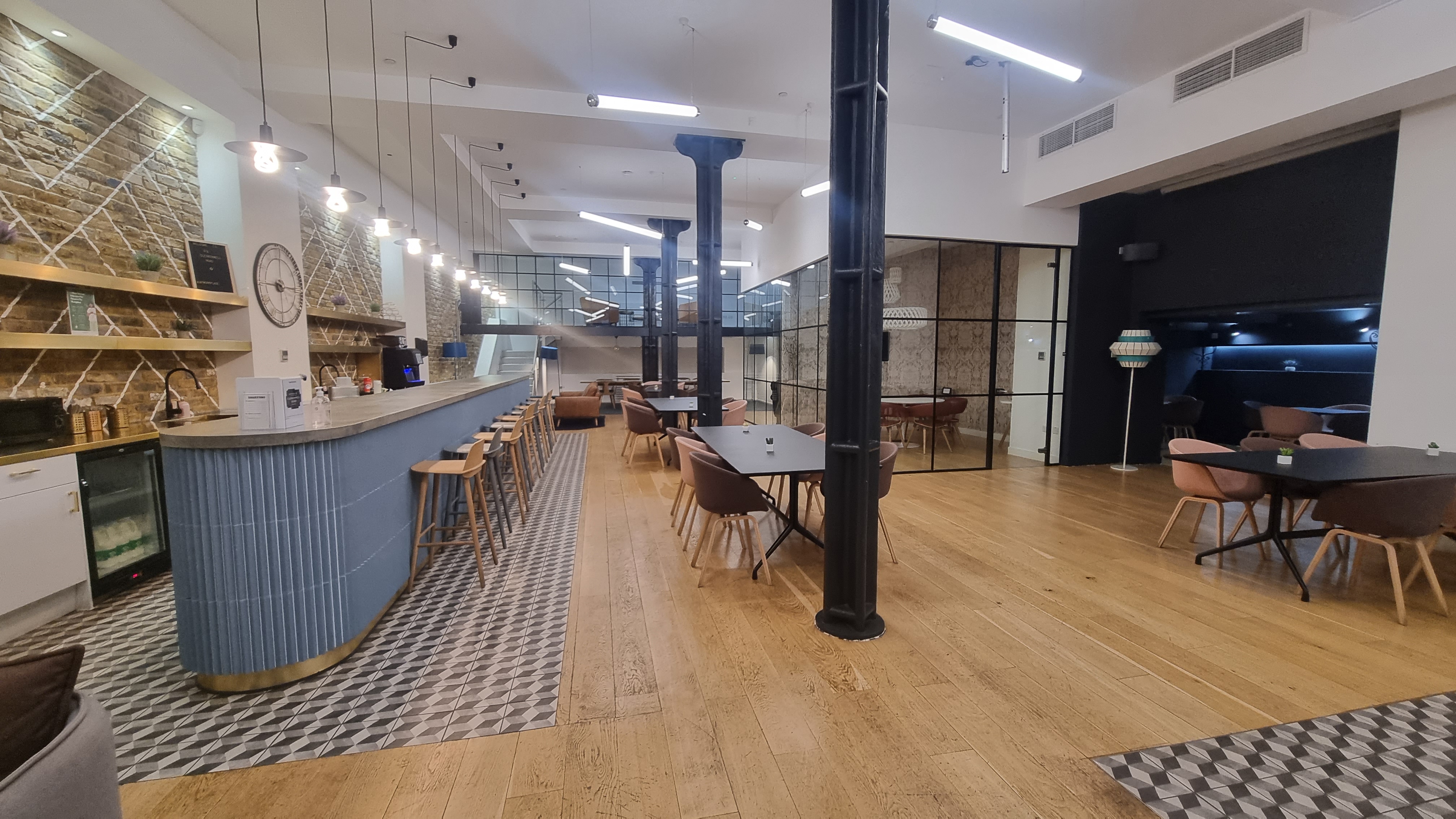 Modern Clerkenwell Event Space with stylish bar, ideal for networking and meetings.