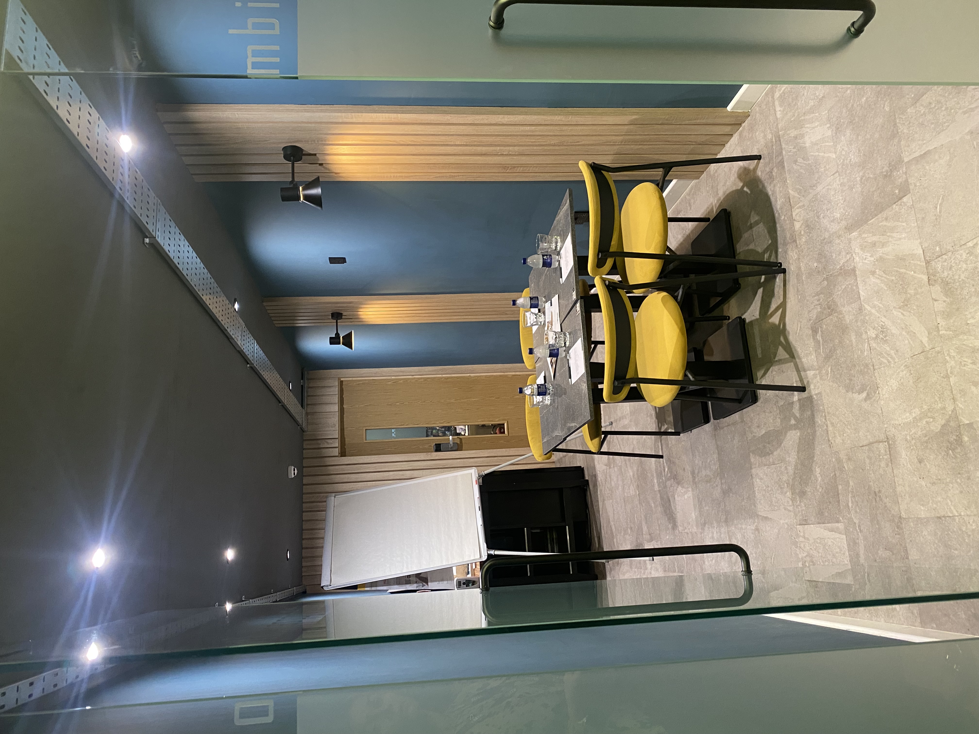 Modern meeting room at The Plaza Hotel, Chorley with stylish yellow chairs for workshops.