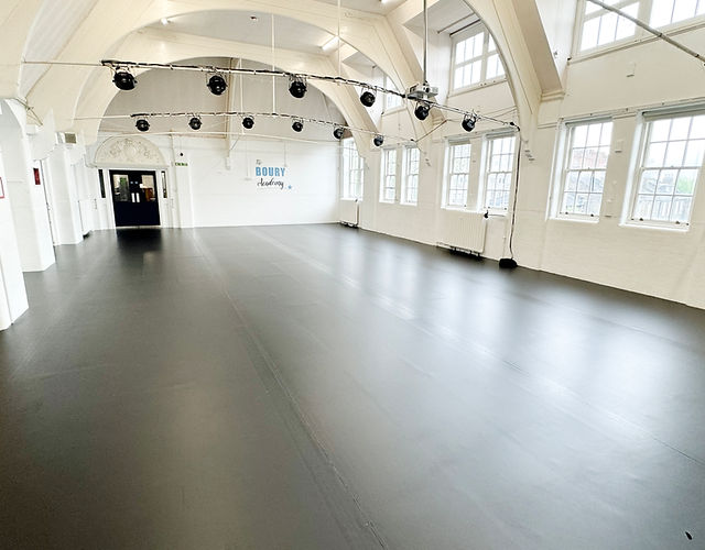 Spacious event venue with high ceilings and natural light at Boury Academy Studios.