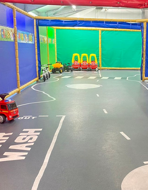 Vibrant children's play area with miniature road for family events in Crazy Club Sidcup.