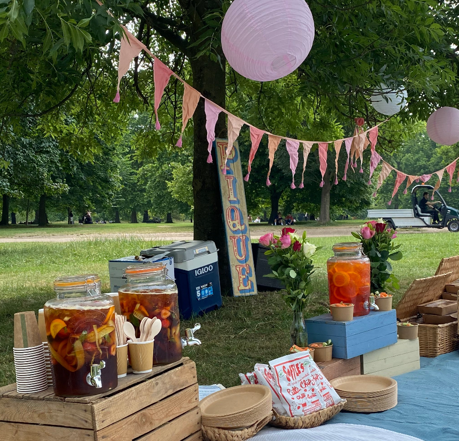 Charming outdoor cafe setup with vibrant bunting for picnics and gatherings.