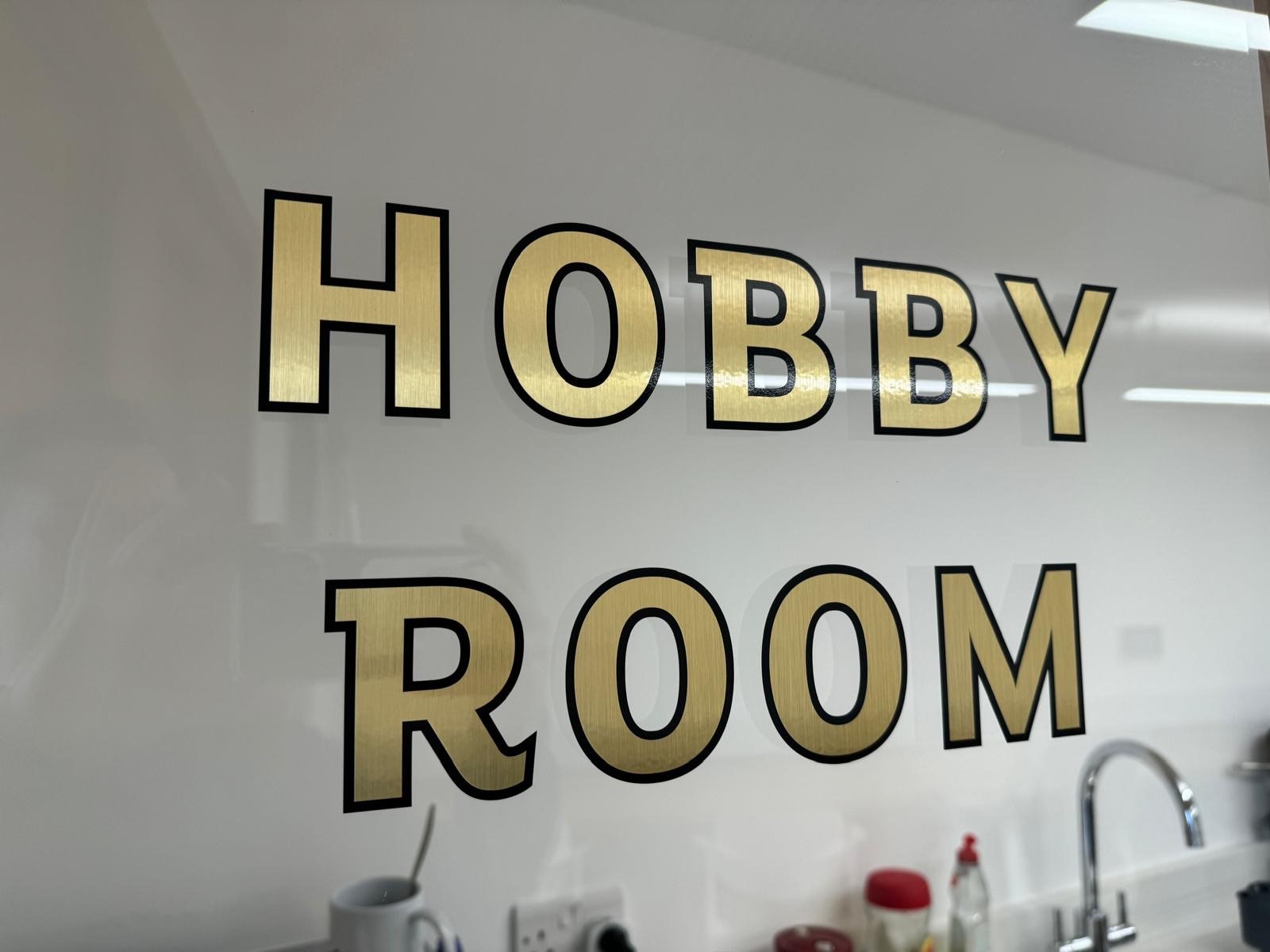 Hobby Room sign in Appleby Blue Almshouse for creative workshops and team-building events.