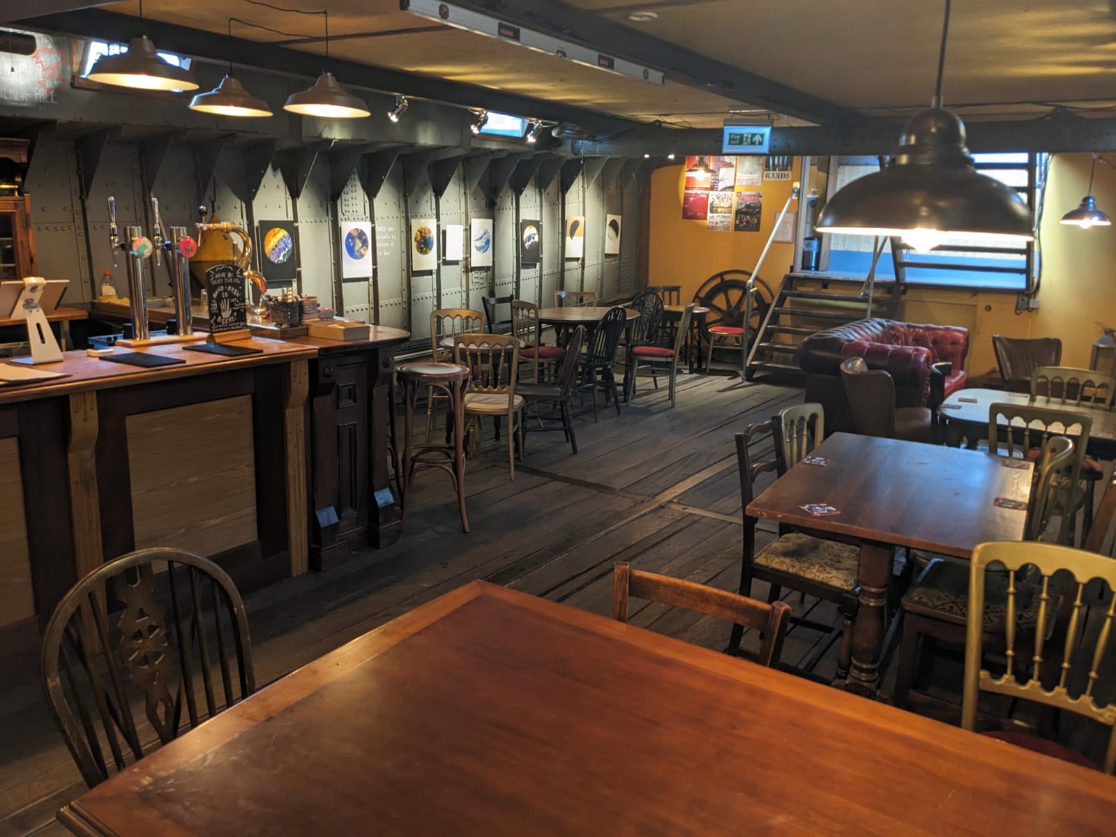 Cozy rustic event space with warm lighting, ideal for intimate gatherings and meetings.