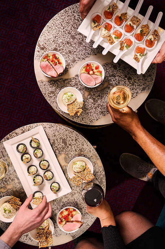 Gourmet appetizers and drinks at The American Bar, London Coliseum for cocktail receptions.