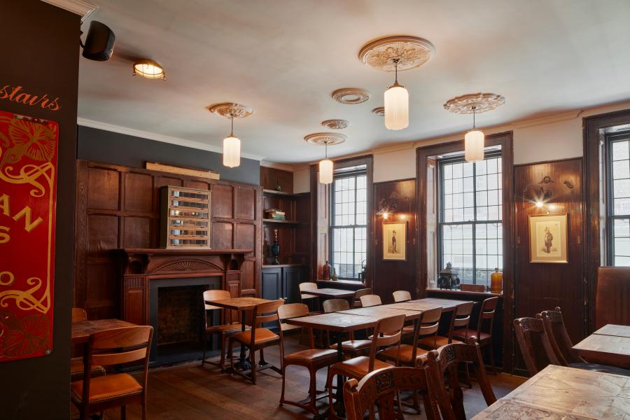 Cozy meeting space with wooden accents at The Newman Arms, ideal for workshops and gatherings.