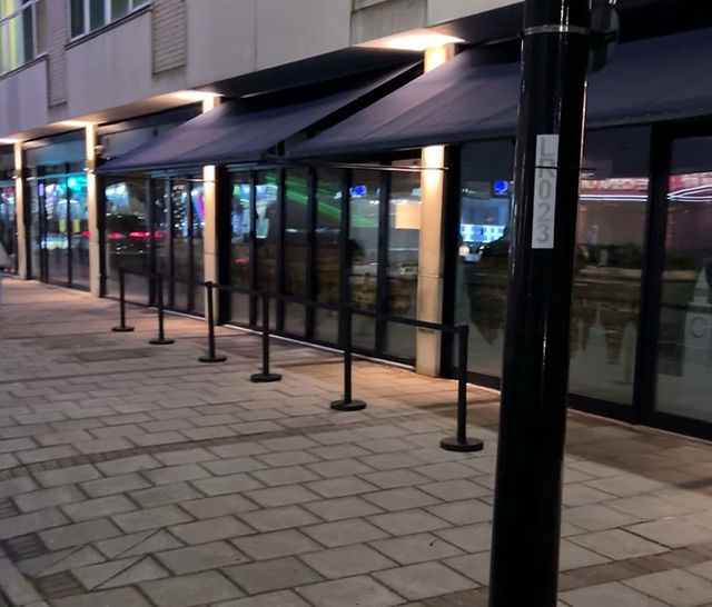 Modern meeting room with glass windows, ideal for events and gatherings.