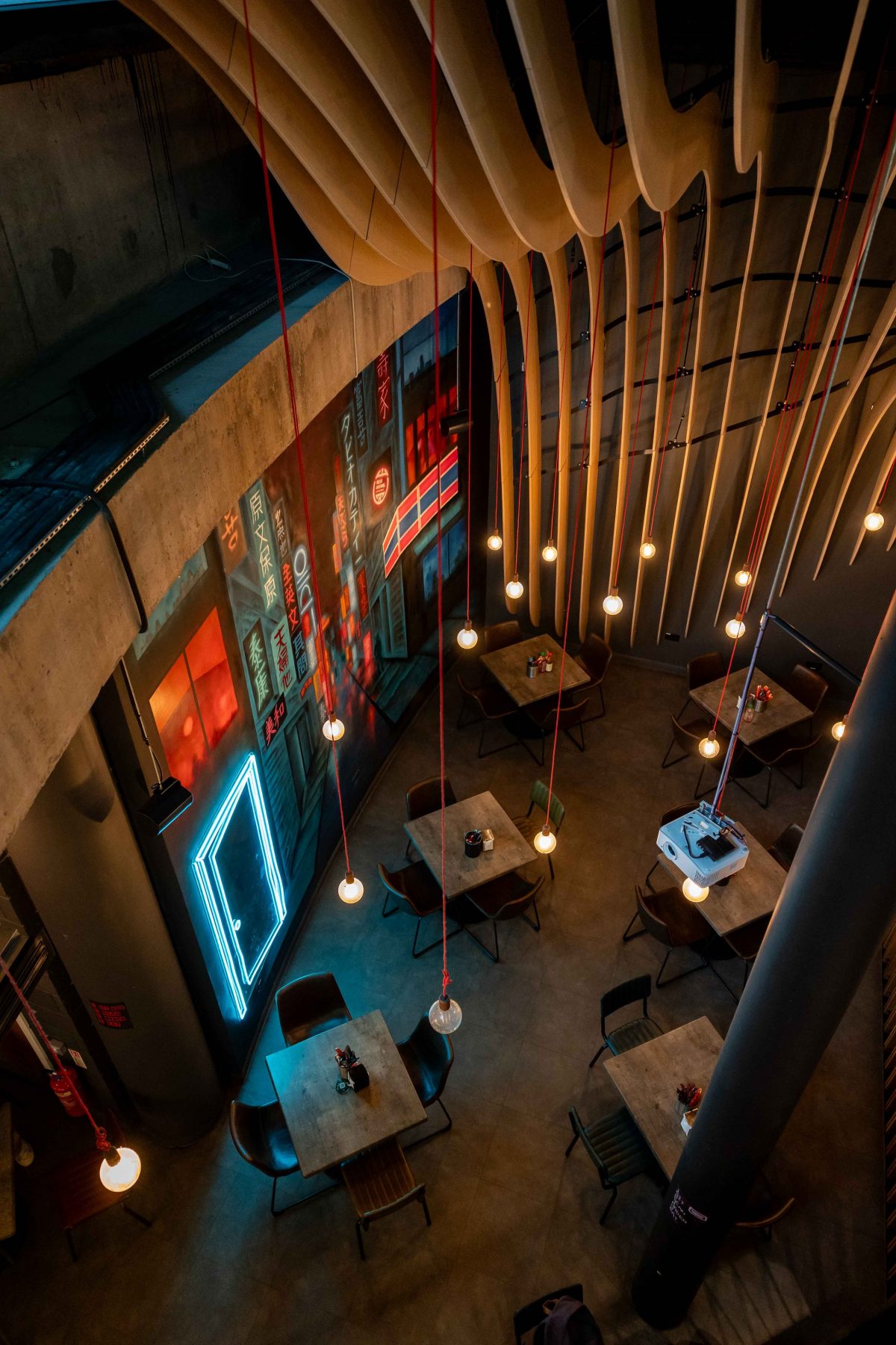 Modern basement event space with stylish lighting, ideal for gatherings and meetings.