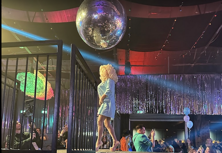 "Vibrant performer on stage at FunnyBoyz Liverpool, perfect for lively parties and events."