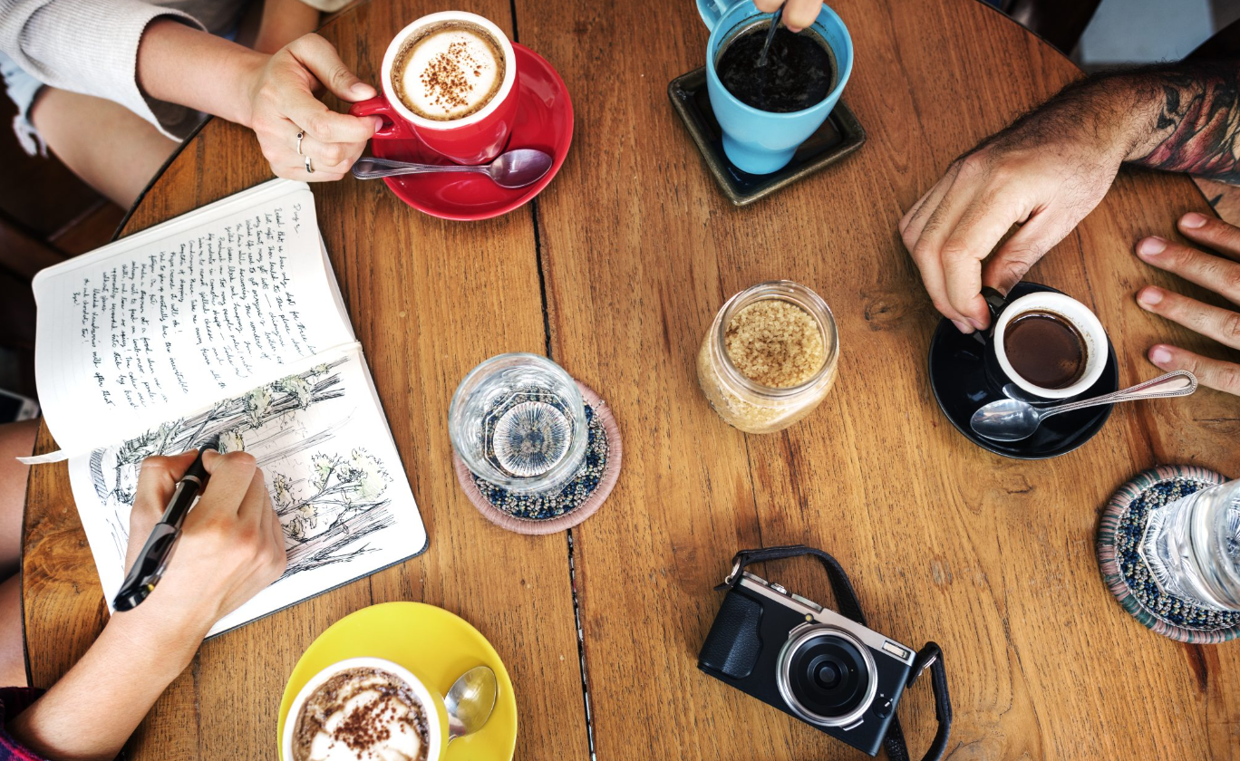 Vibrant coffee meeting setup at Machiato Coffee House for networking and brainstorming.