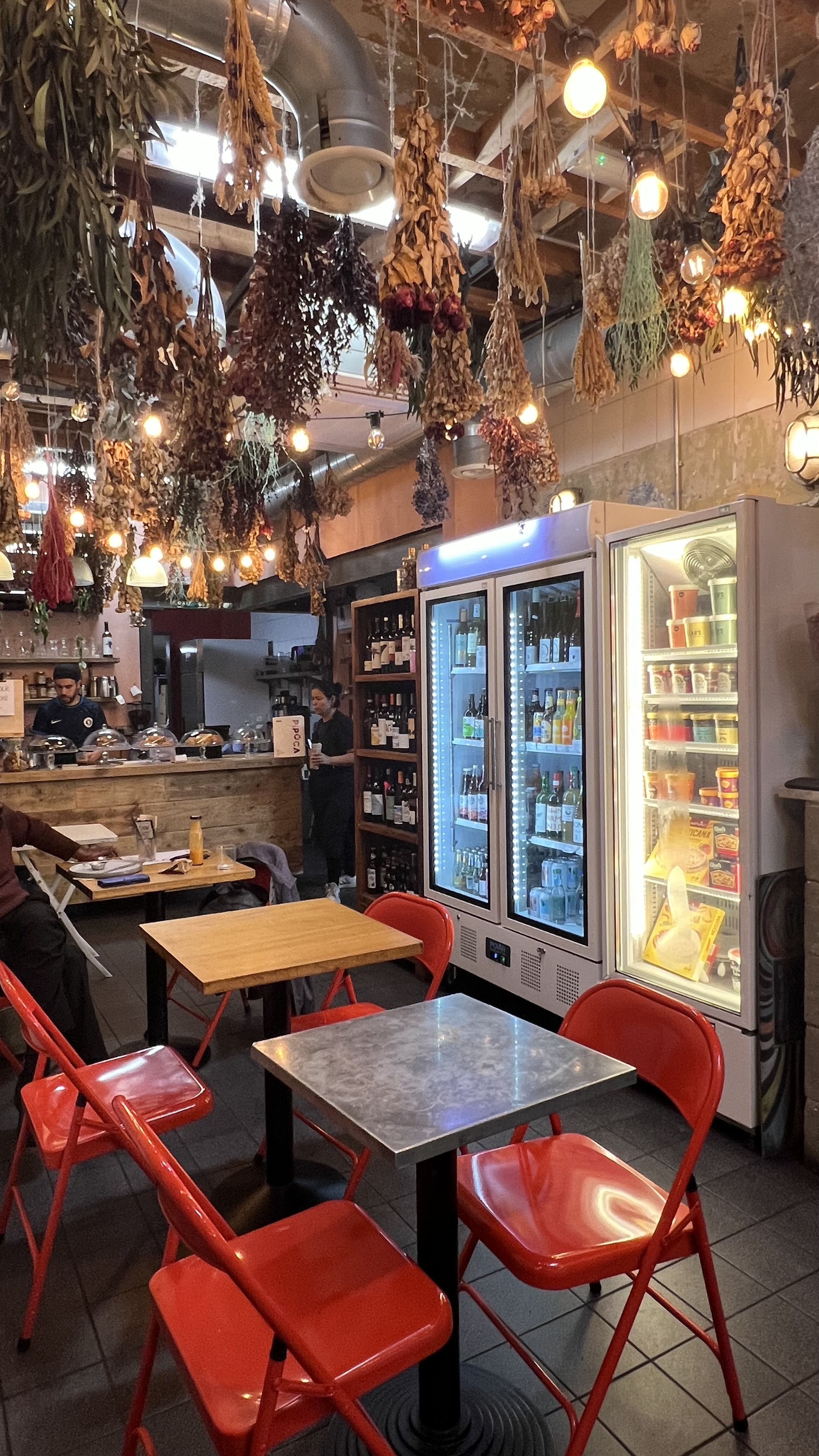 Cozy Pipoca Vegan Bar with rustic decor, ideal for casual meetings and networking events.