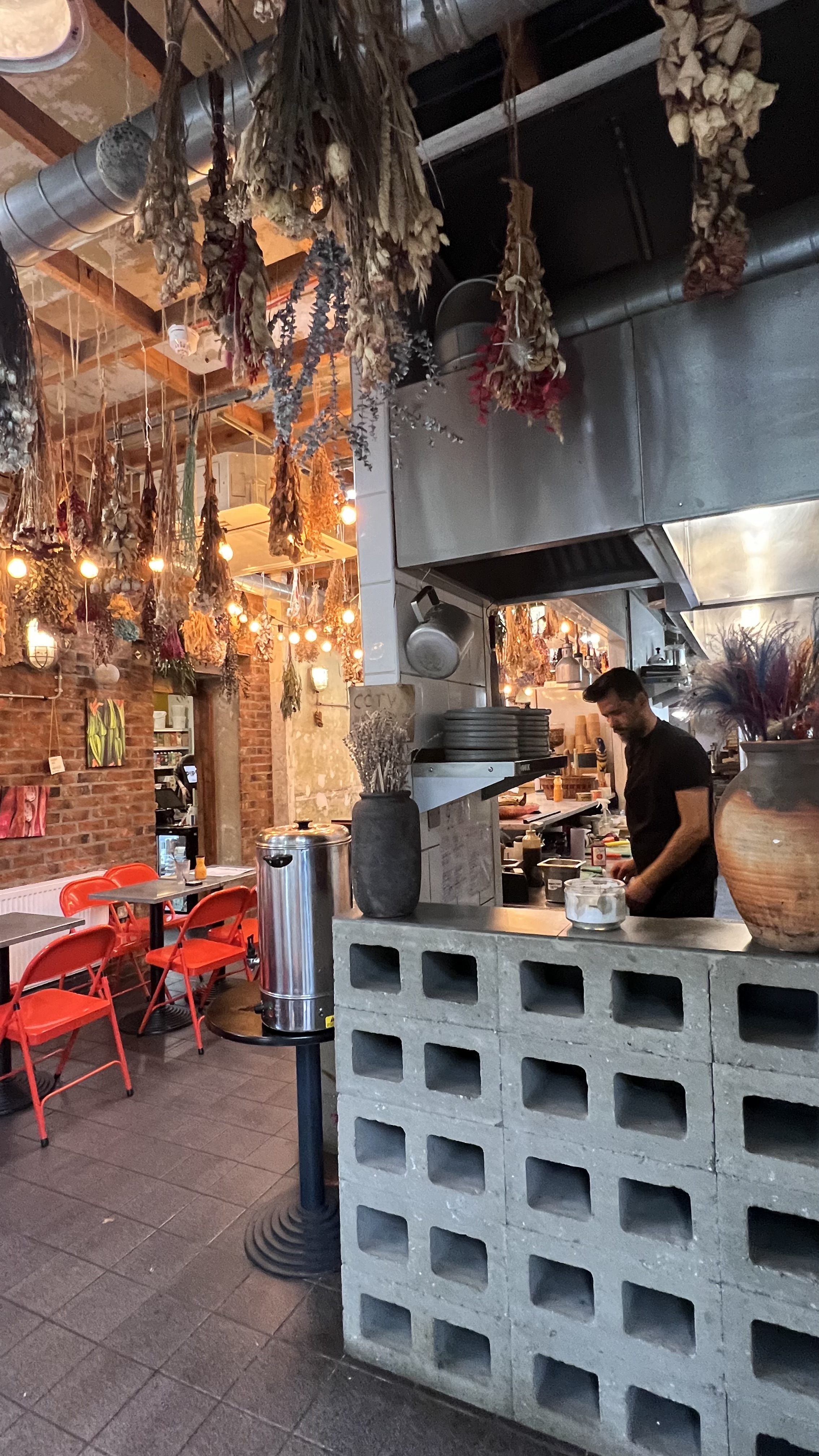 Vibrant rustic kitchen at Pipoca Vegan Bar for culinary events and cooking classes.