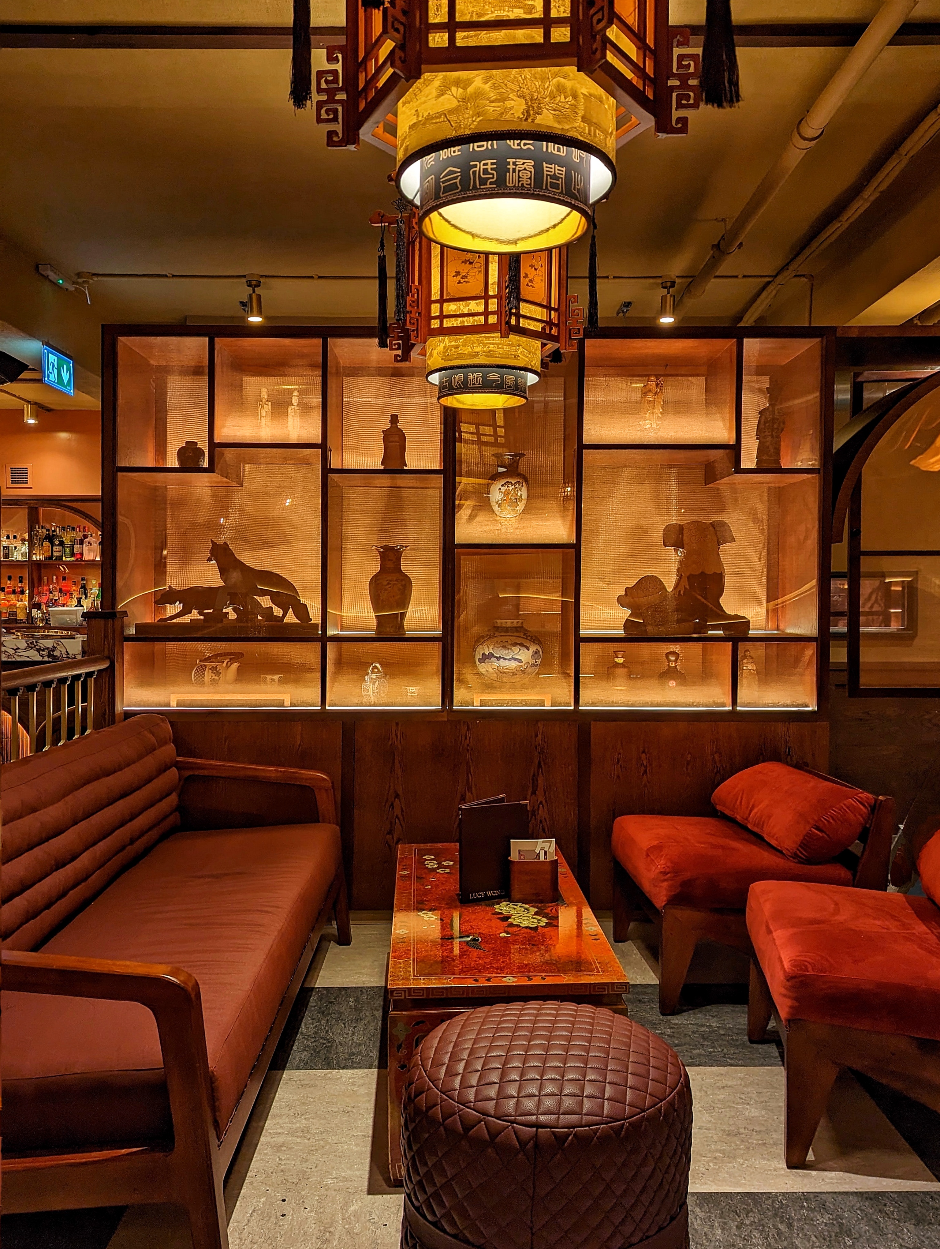 Stylish lounge at Lucy Wong, featuring warm lighting for networking events.