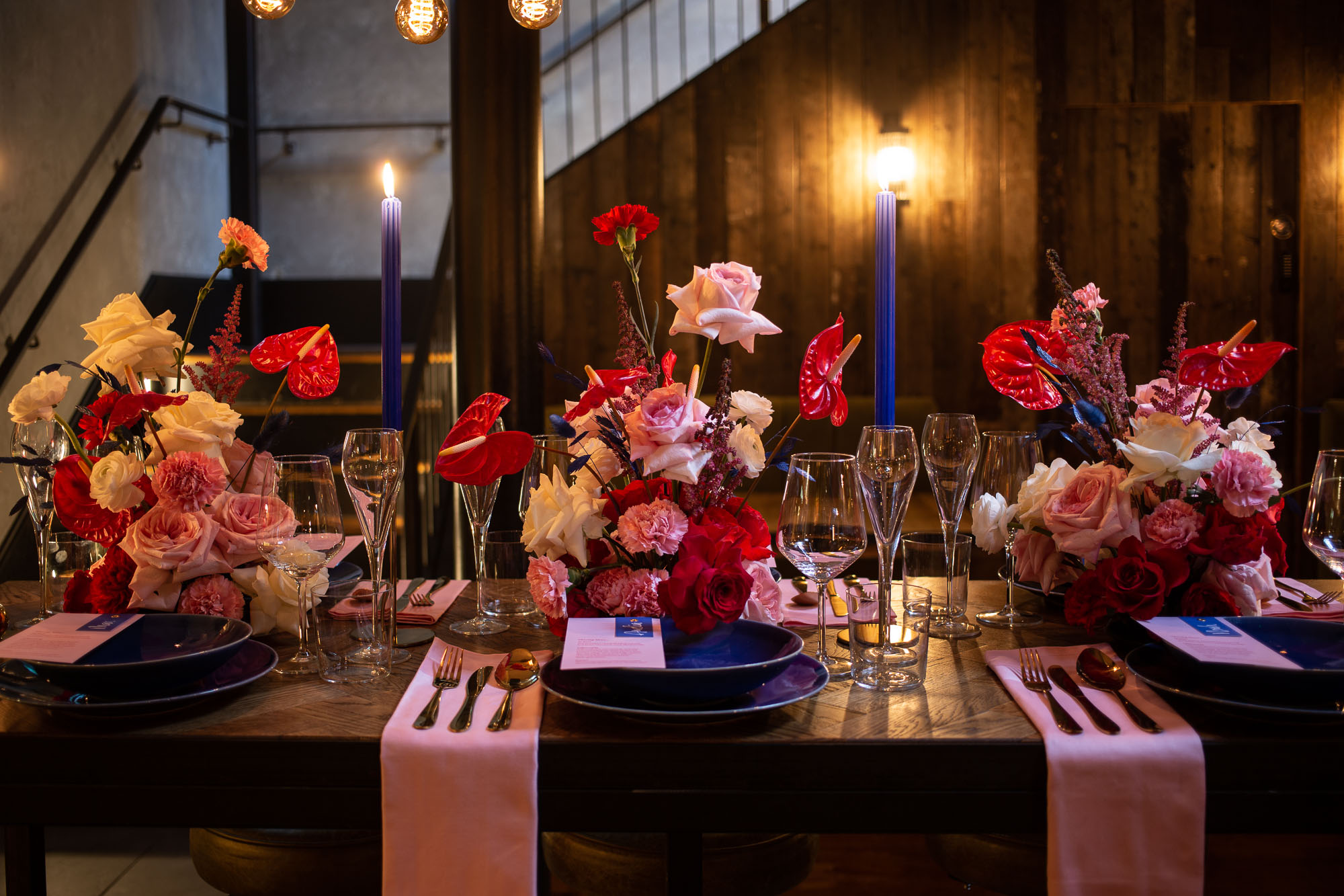 Elegant dining setup with floral centerpieces for upscale weddings and corporate events.