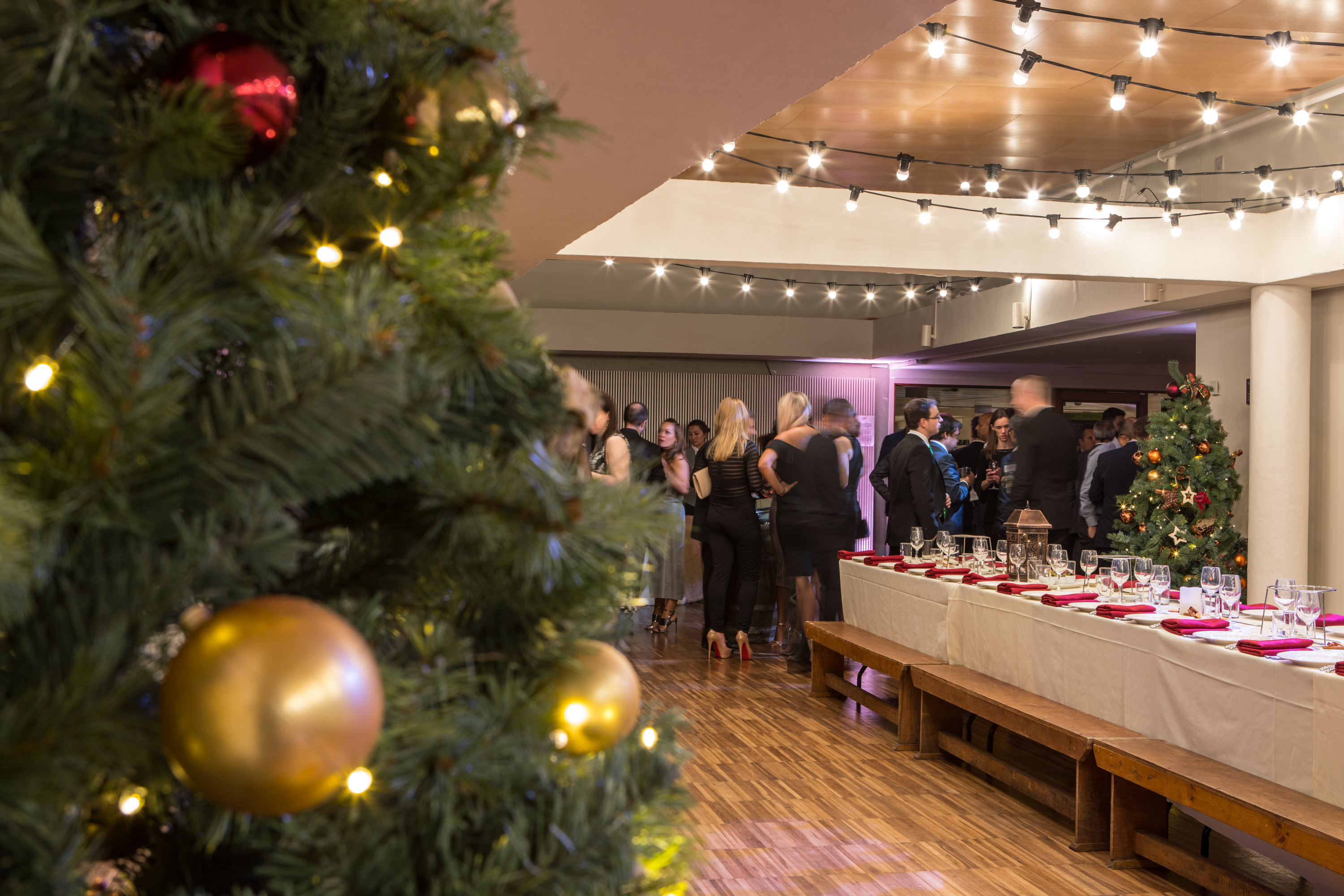 Festive holiday gathering at Southbank Centre with elegant decor and warm lighting.