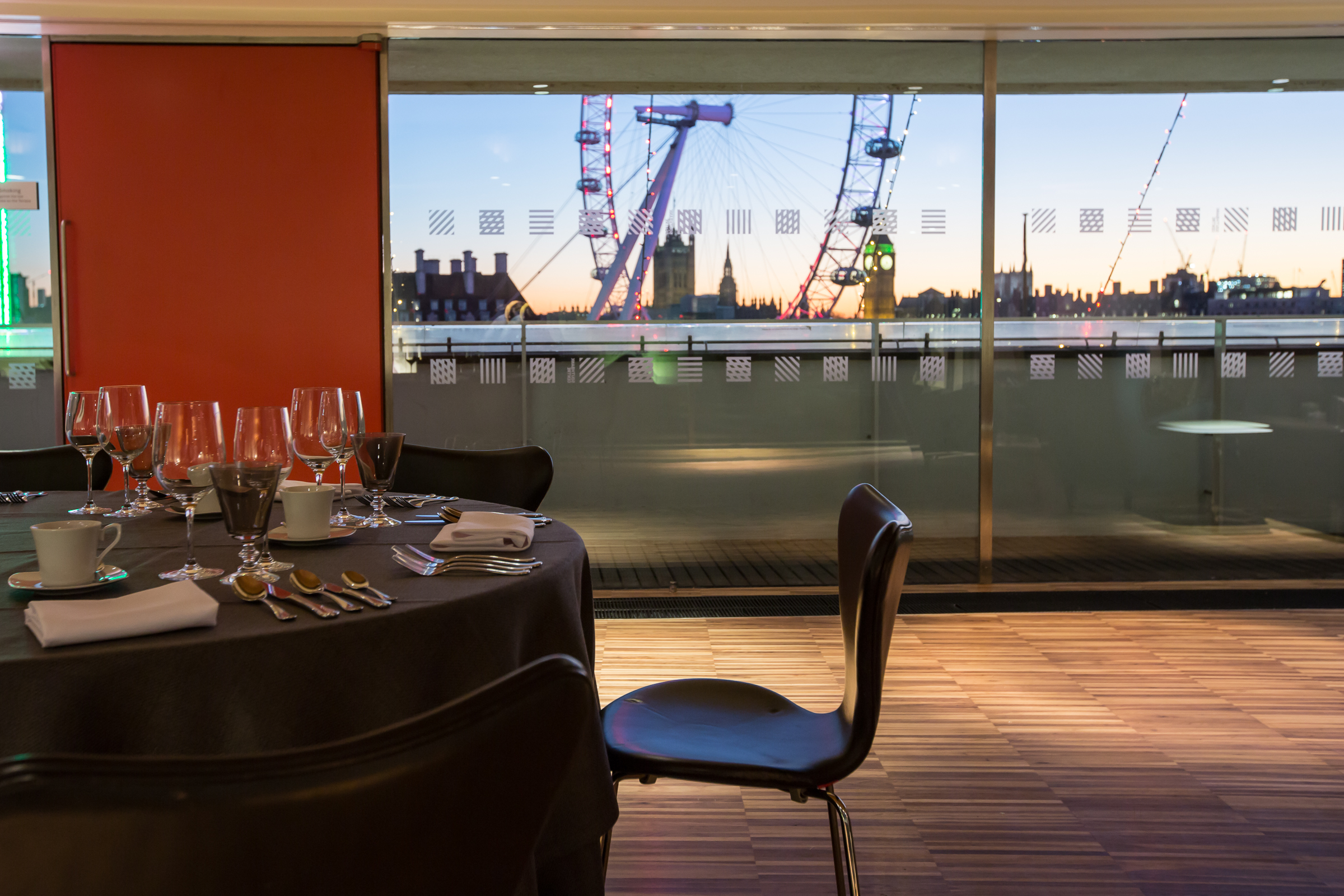 Festive Southbank Centre event with elegant dining and London Eye sunset view.