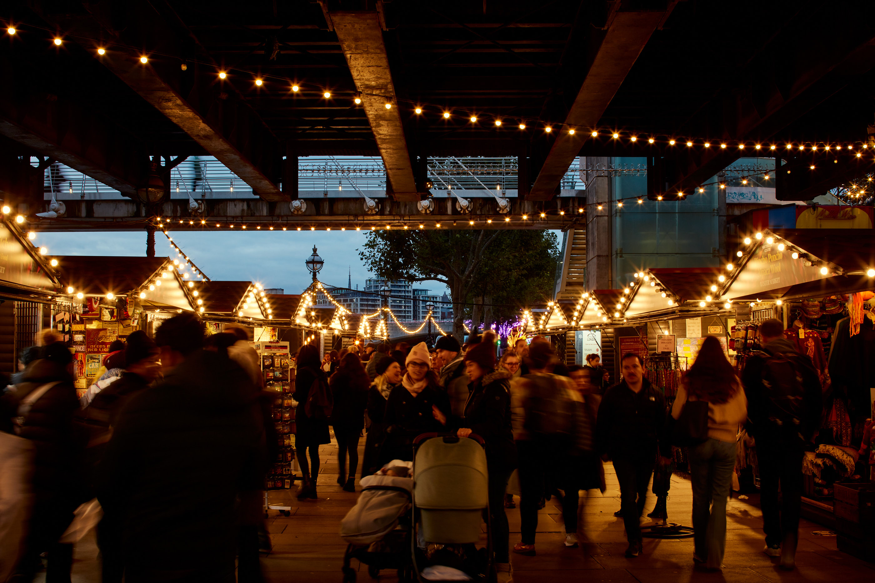 Festive outdoor market at Southbank Centre with string lights, ideal for seasonal events.