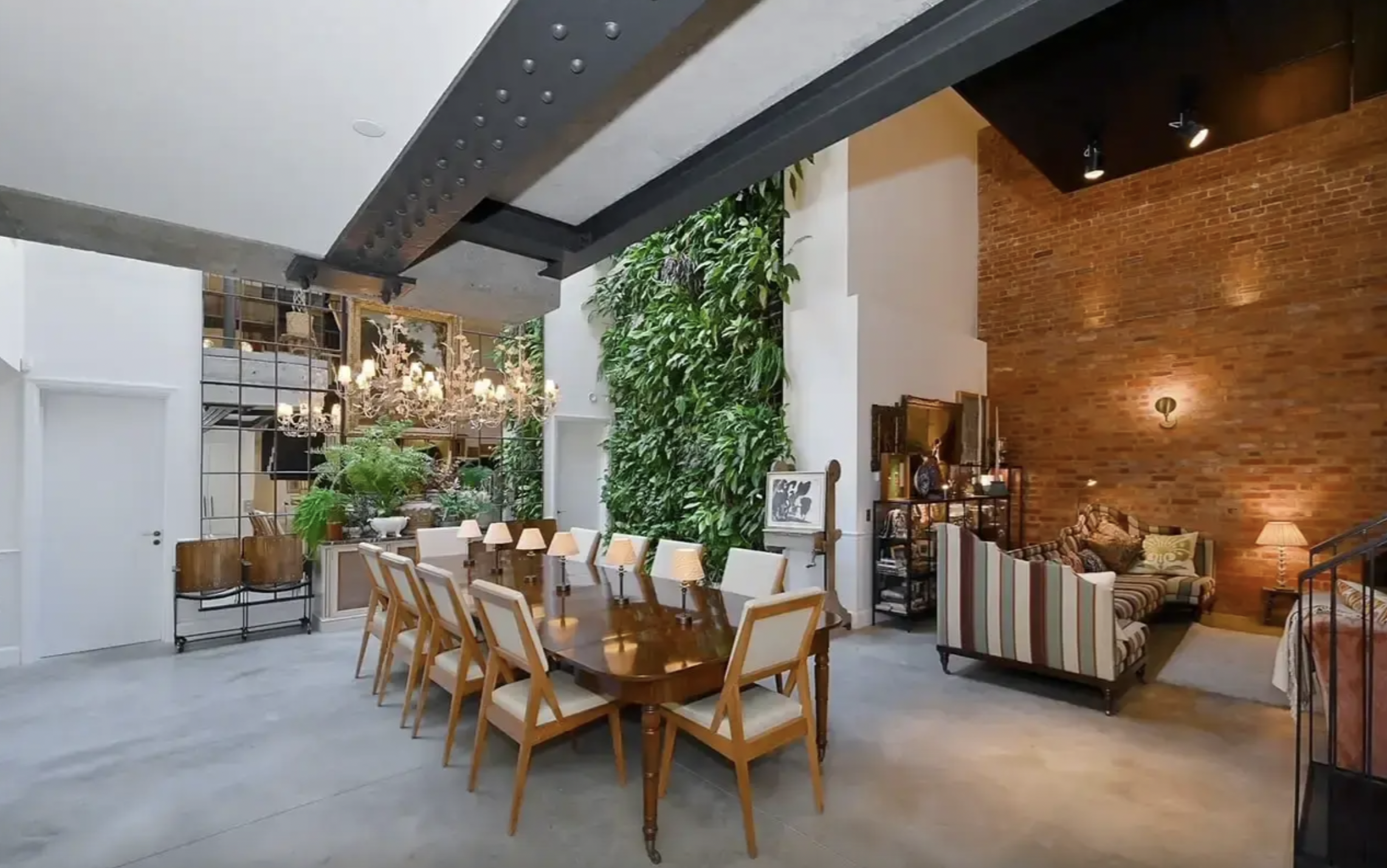 1900s Brewery Cooperage Loft meeting space with a rustic wooden table for events.