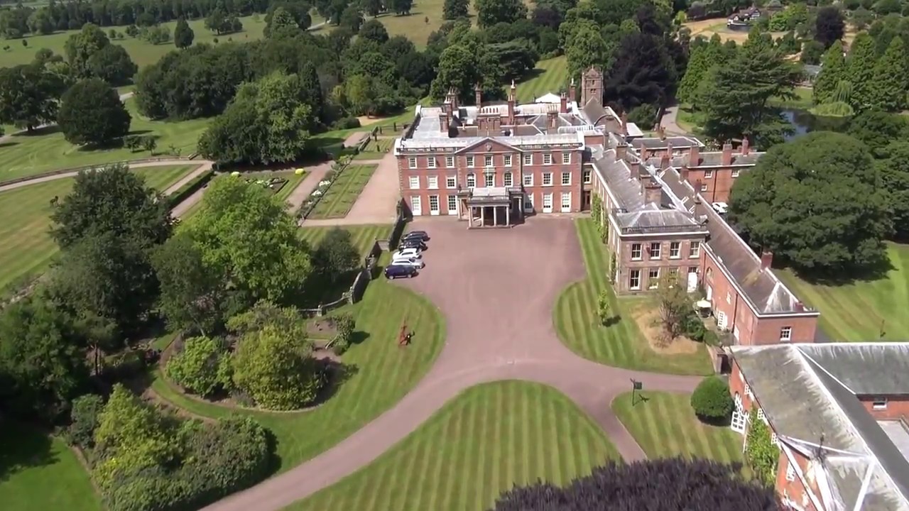 The House in Weston Park: elegant venue for corporate retreats and weddings, surrounded by greenery.