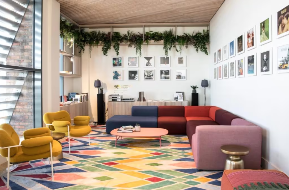 Vibrant lounge area with colorful furniture for networking events and informal meetings.