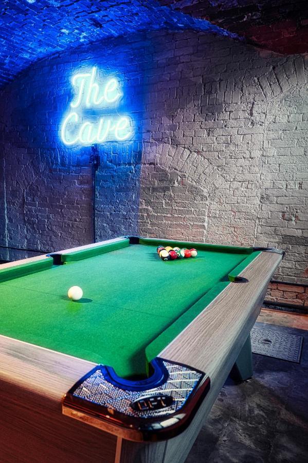 Cave at Hawkstone Hall: vibrant pool table in rustic setting for networking events.