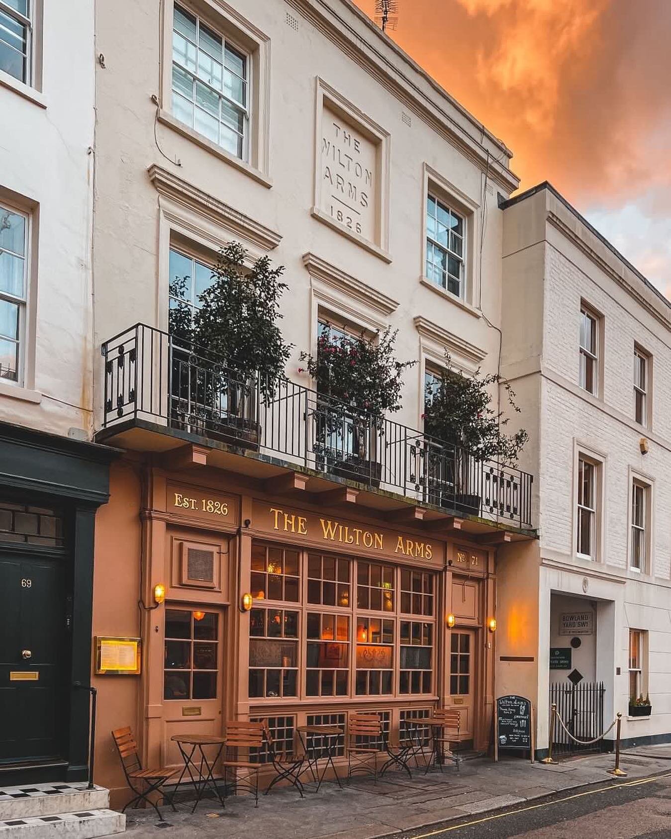 Victorian pub facade with balconies, ideal for intimate gatherings and networking events.
