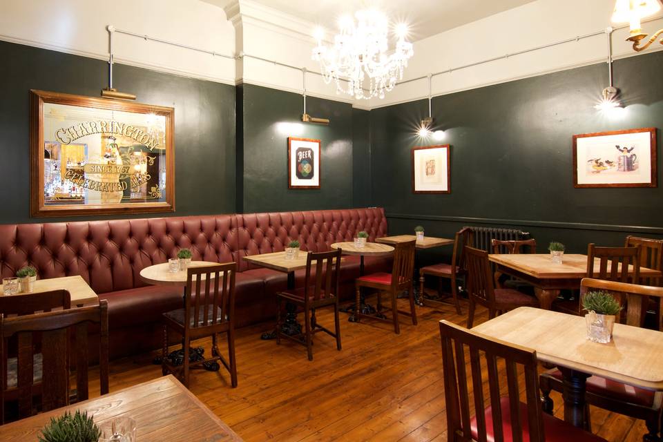 Cozy interior of The Vine venue with plush seating for intimate meetings and events.