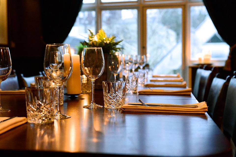 Elegant dining table setup in The Vine restaurant for intimate gatherings and corporate dinners.