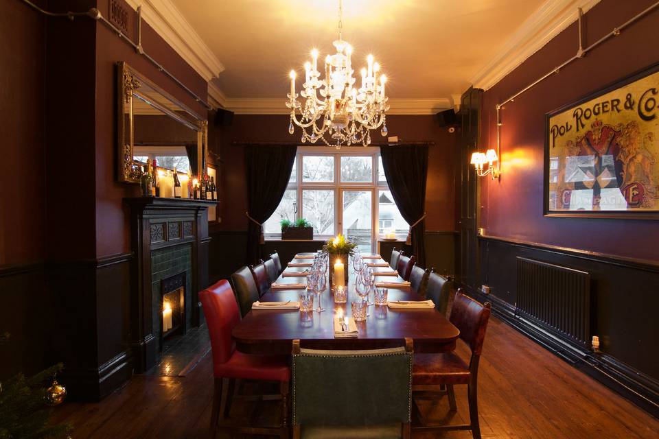 Elegant private dining room with warm lighting for corporate events and intimate meetings.