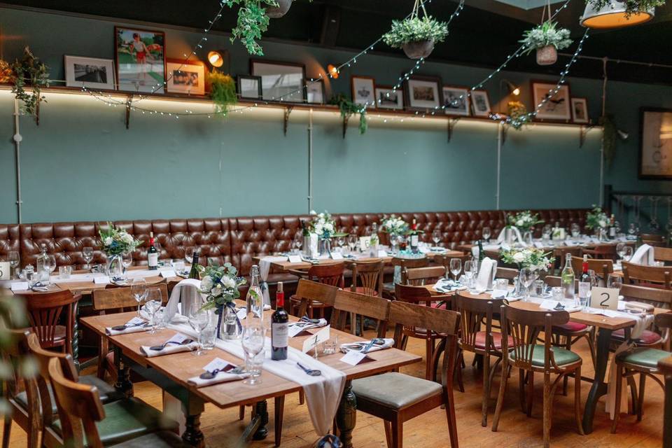 Elegant dining space with floral centerpieces, perfect for weddings and events.