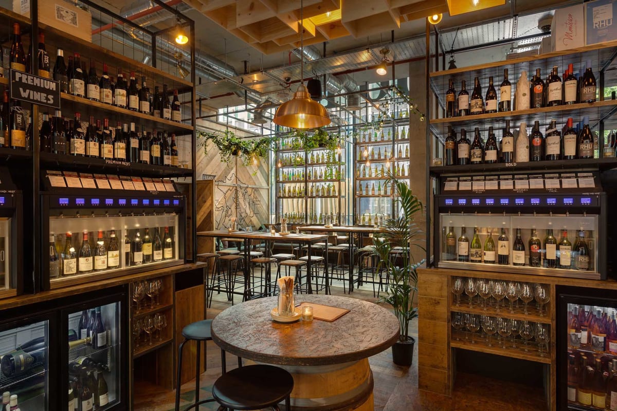 Stylish wine bar with warm lighting, perfect for intimate gatherings and networking events.