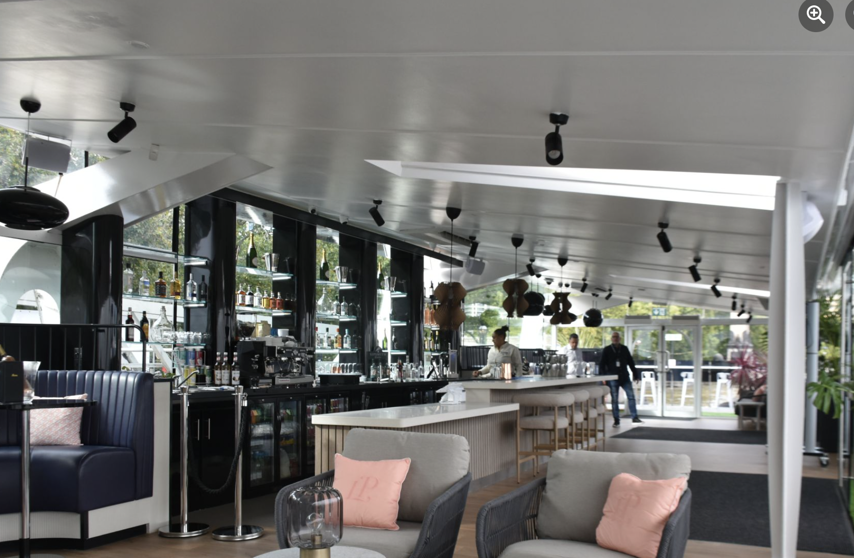 Modern Clipper Lounge EMB bar with ample seating for upscale events and gatherings.