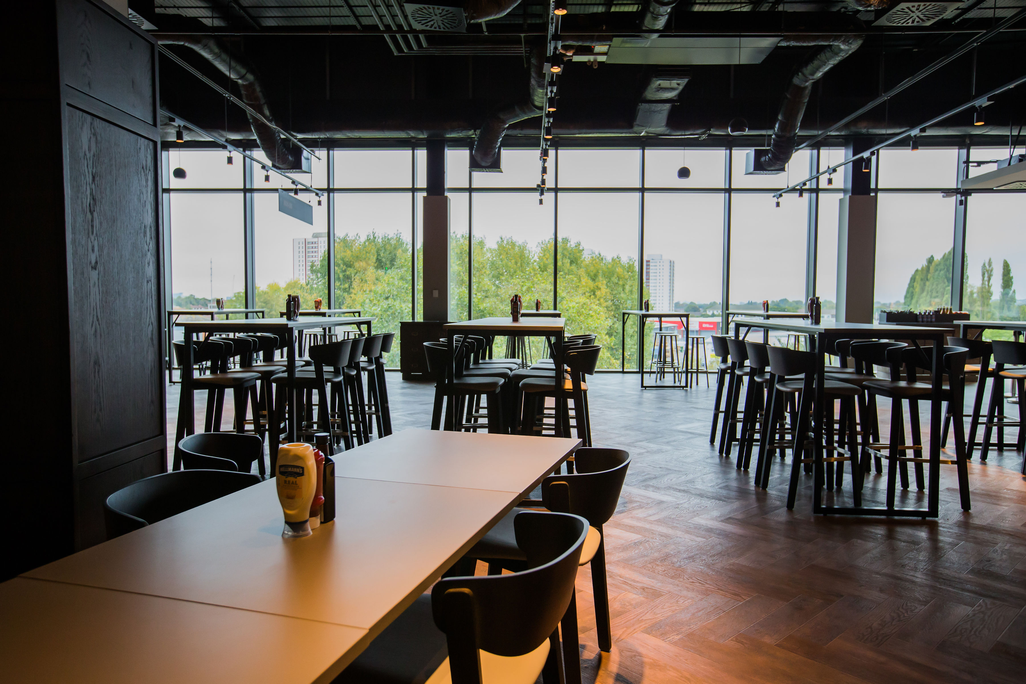 Modern event space at The Clubhouse Bar & Kitchen, Allianz Stadium, for networking or gatherings.