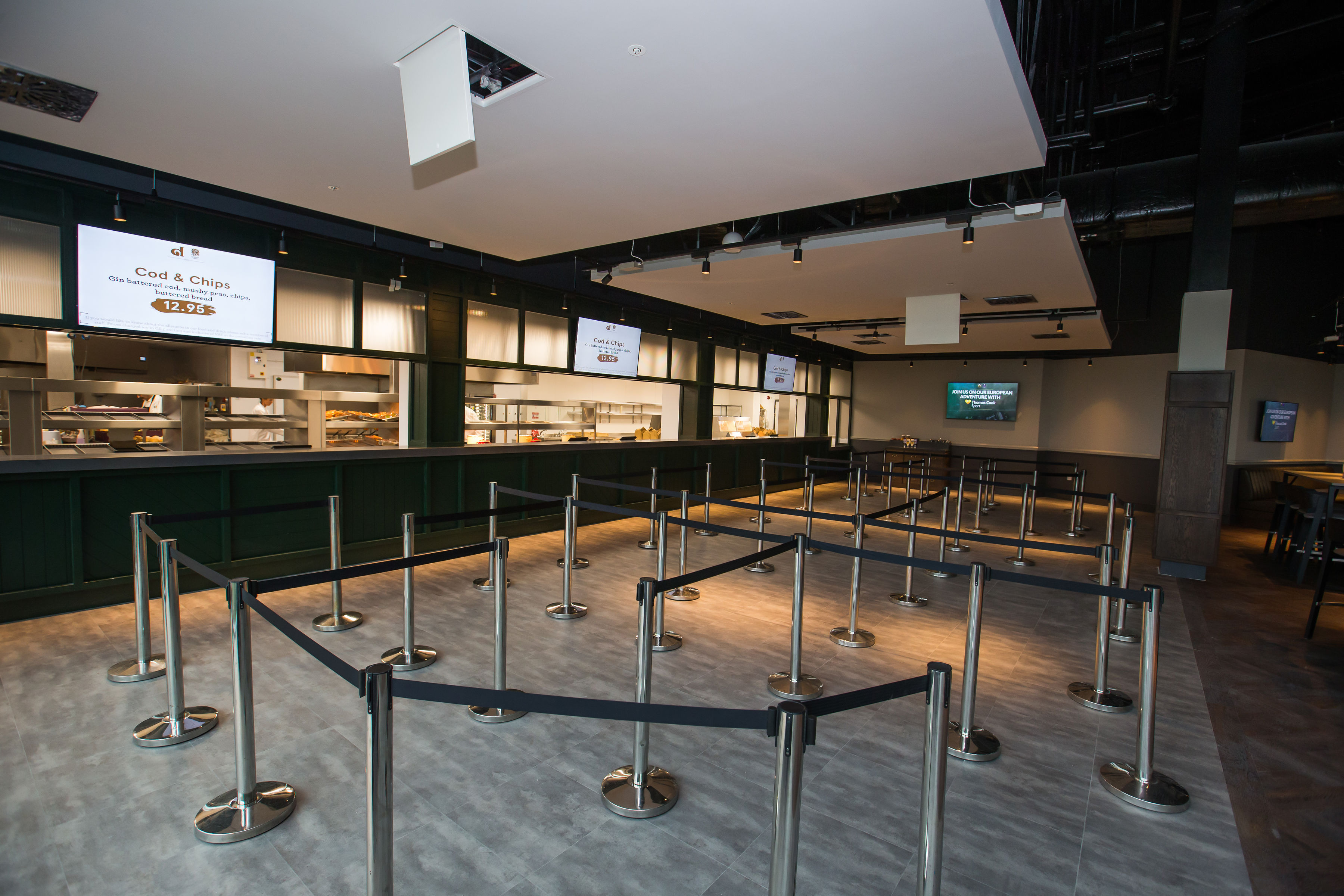 Modern event space at Allianz Stadium with retractable barriers for efficient catering.