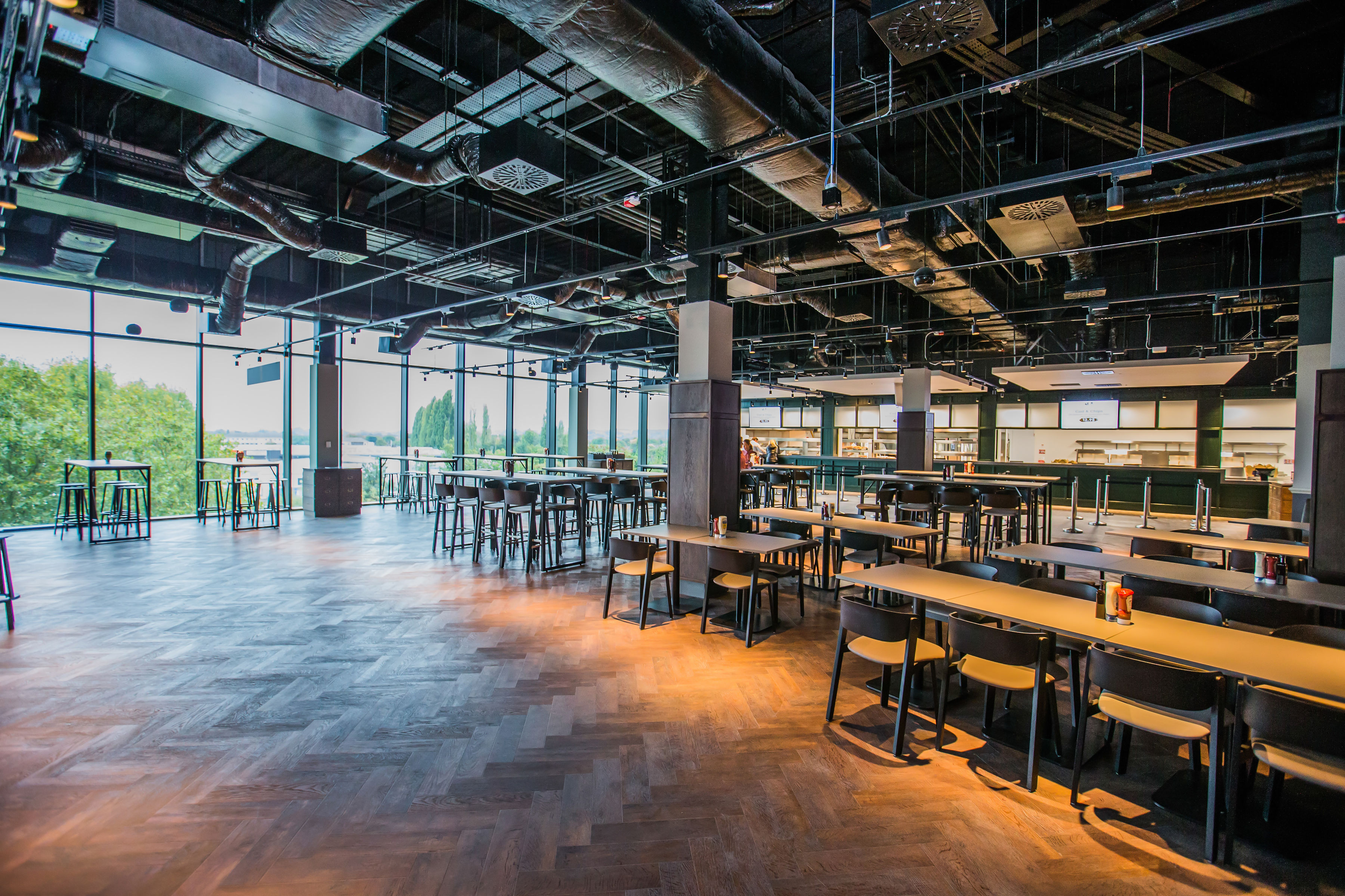 The Clubhouse Bar & Kitchen at Allianz Stadium: modern event space with high ceilings.