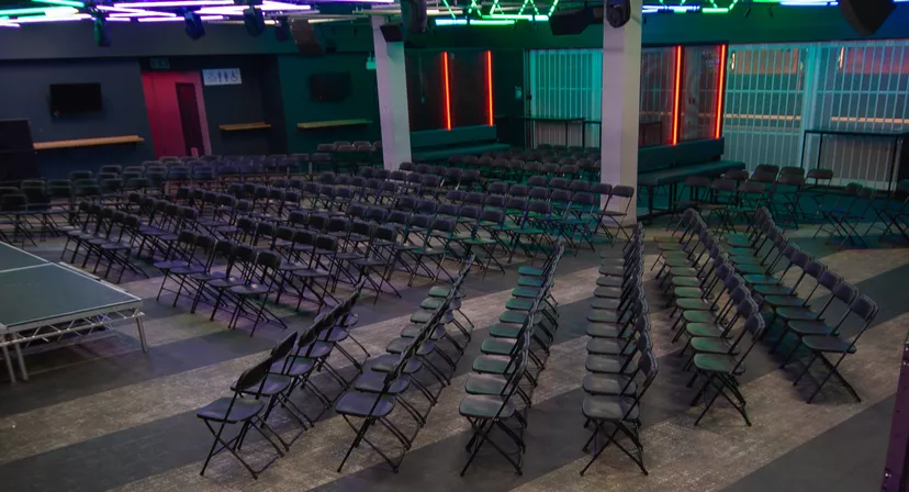 Lobby event space at The Forum Hertfordshire with folding chairs for seminars.