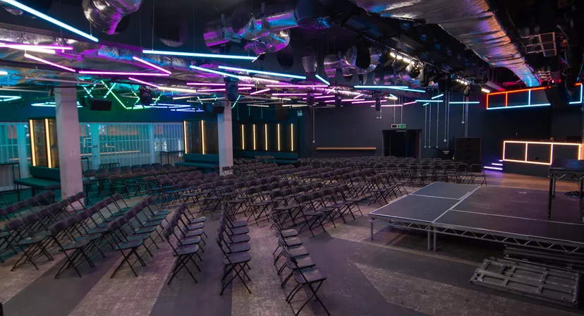 Lobby area at The Forum Hertfordshire with black chairs for presentations and events.