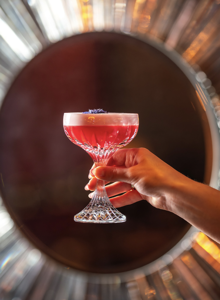 Elegant cocktail in glass at BACCARAT BAR, Harrods Restaurants - upscale event catering.