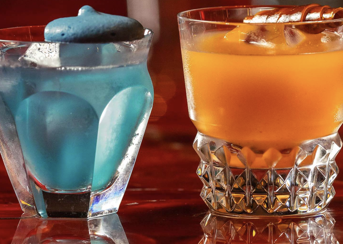 Vibrant blue and orange cocktails at BACCARAT BAR, ideal for events and networking.