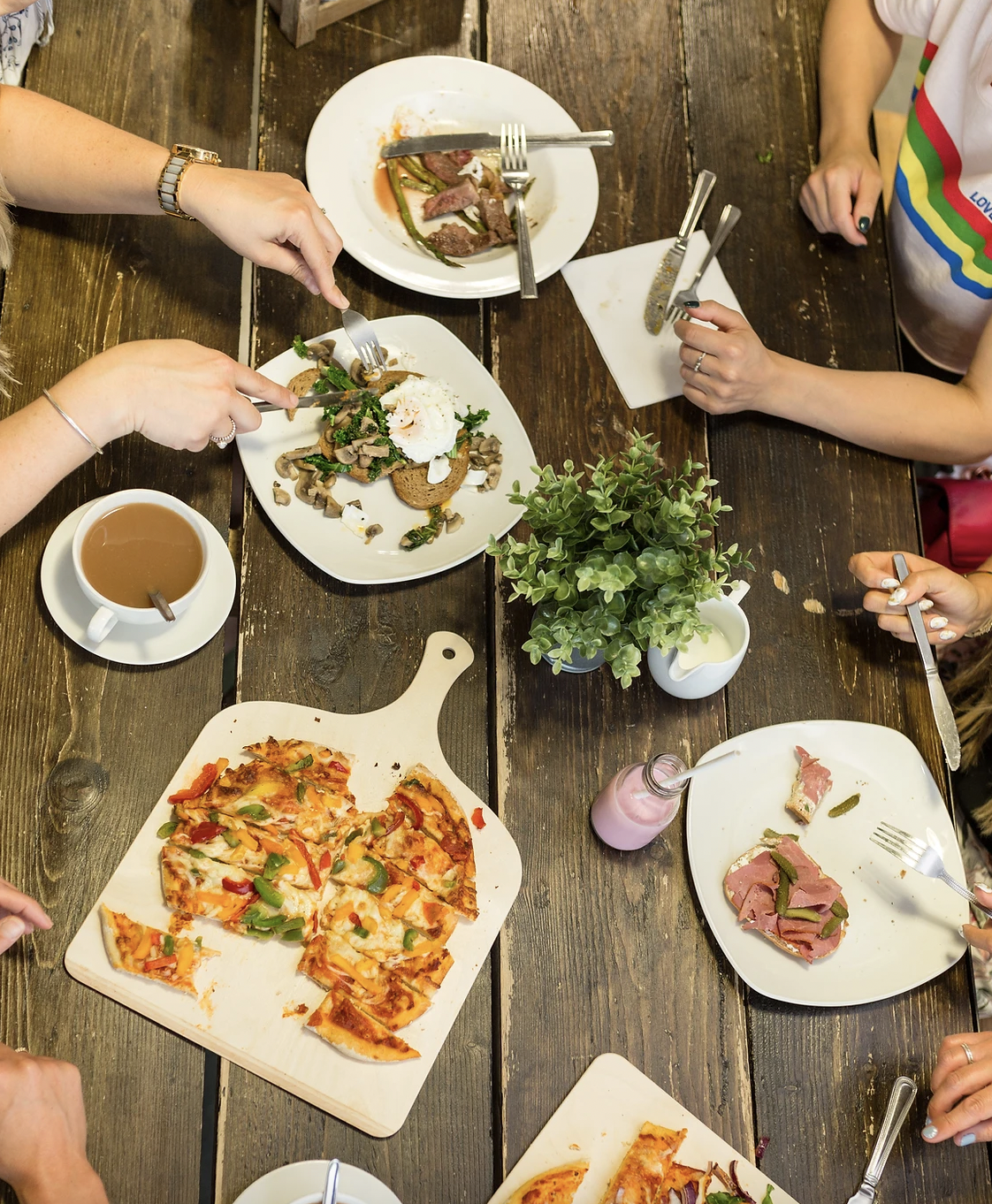 Vibrant YMCA Purplespoon Cafe venue with pizza and salad for networking events.