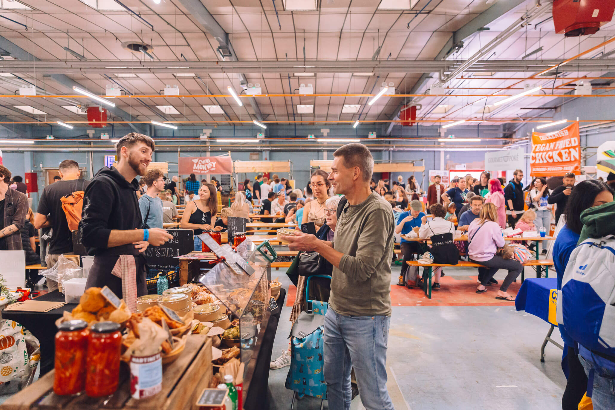 Showroom Bristol event space bustling with attendees at vibrant food stalls.