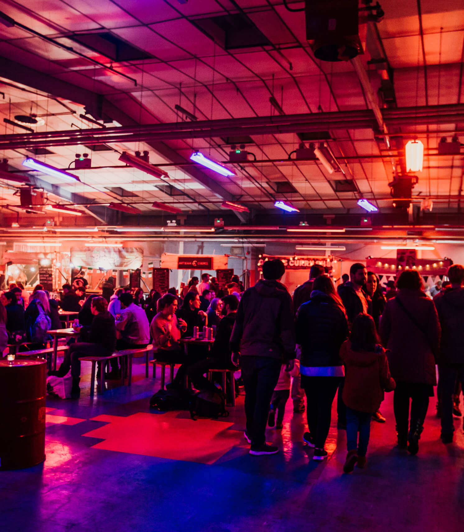 Vibrant kitchen event space with dynamic lighting for networking and mingling.