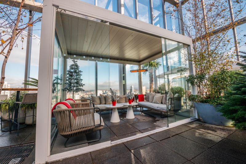 Modern glass-enclosed lounge at 20 Stories Restaurant for networking events and meetings.