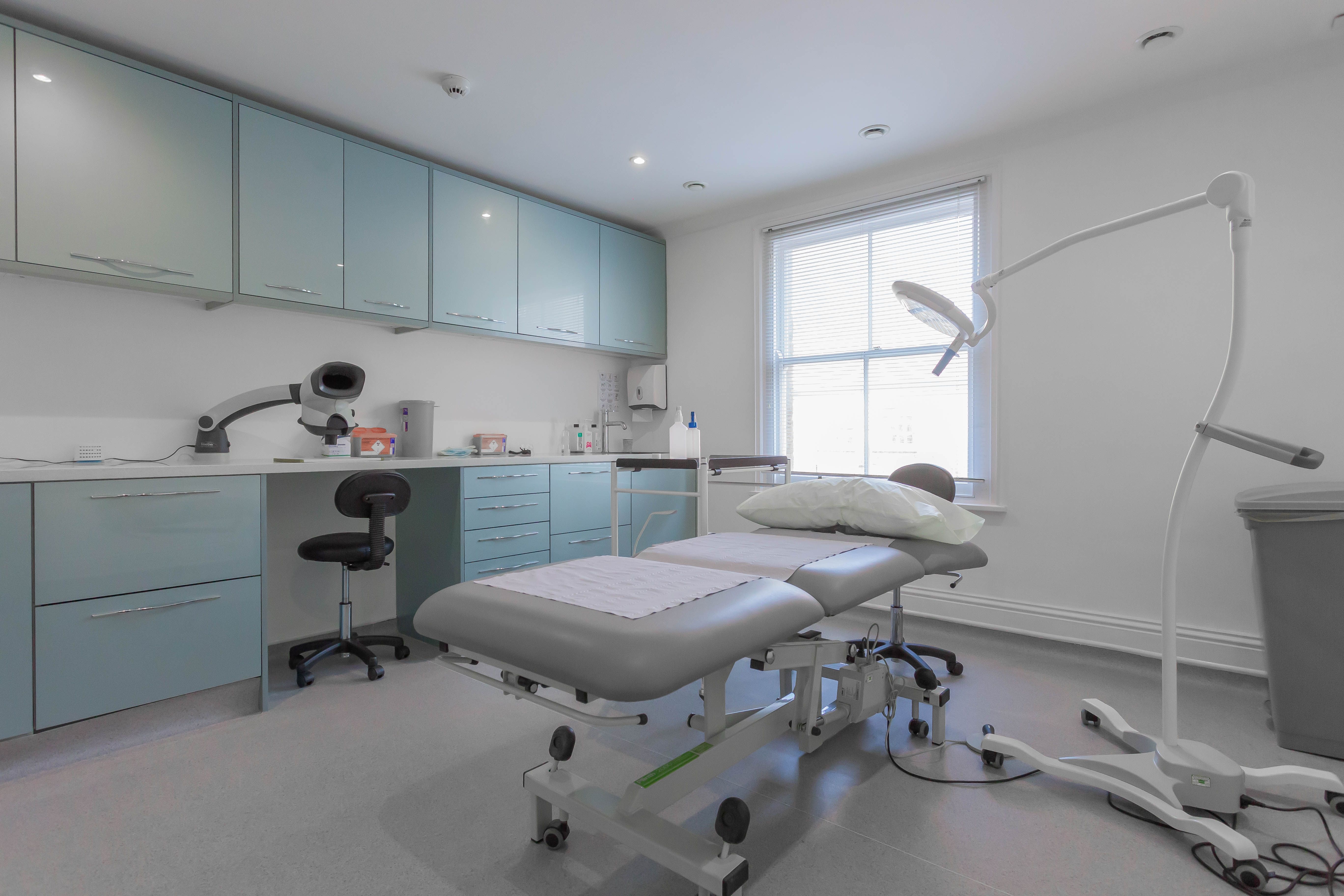 Modern treatment room in aesthetics clinic, ideal for health workshops and consultations.