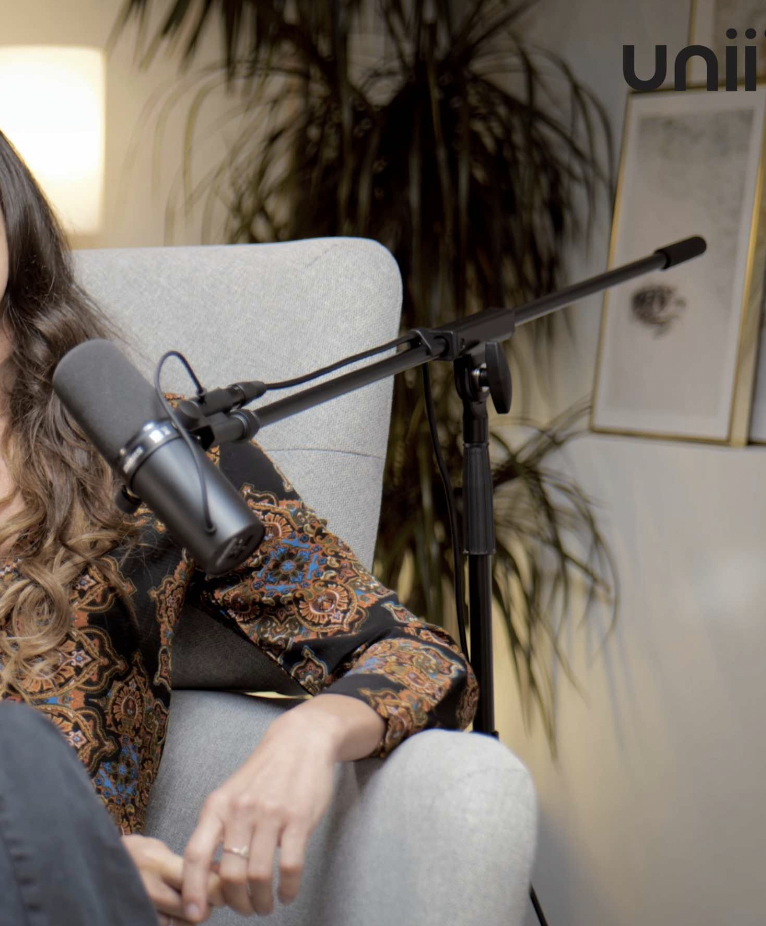 Podcast studio with high-quality microphone and inviting seating for engaging discussions.