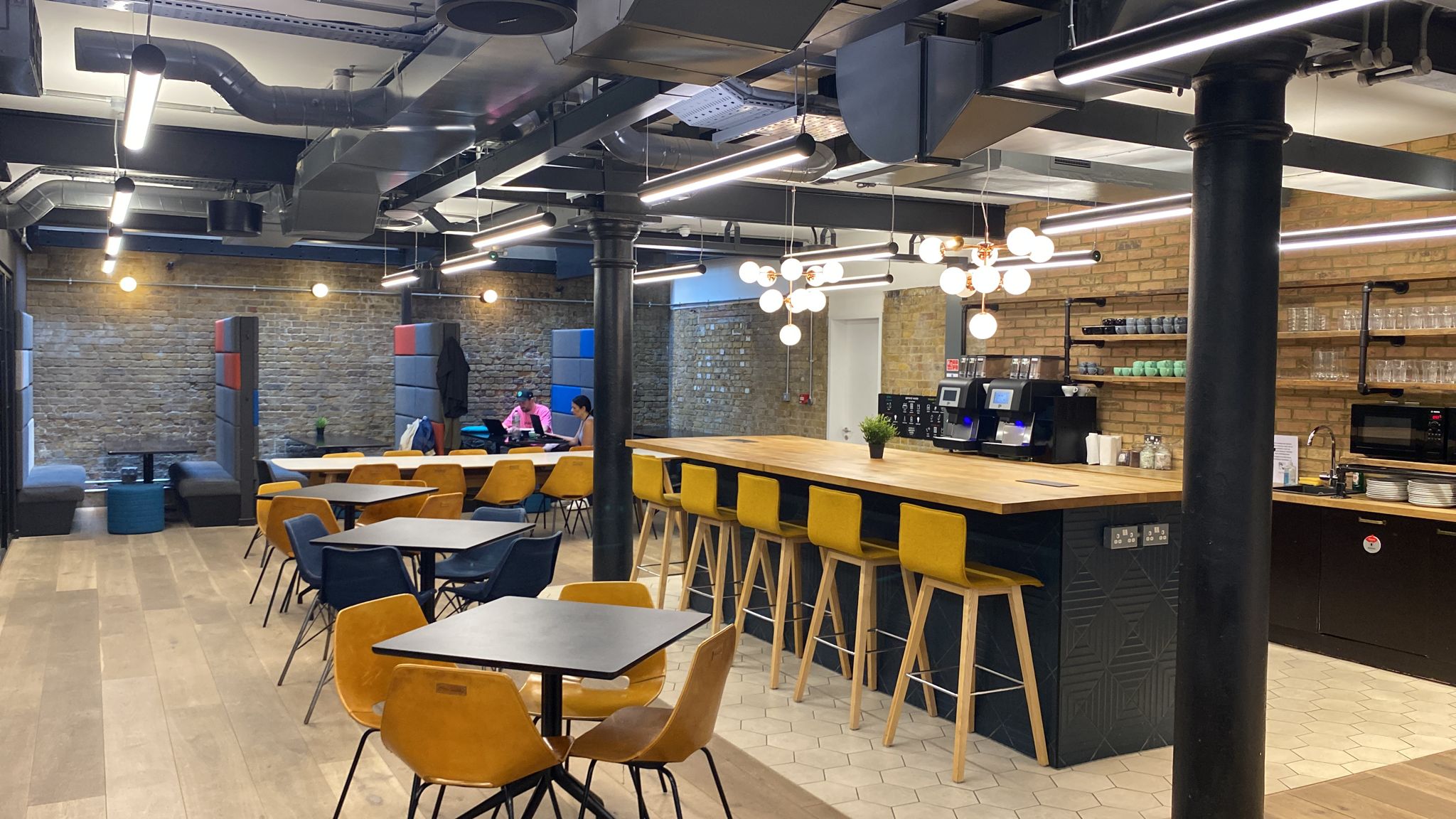 Modern event space at Notcutt House with stylish bar, ideal for networking and meetings.