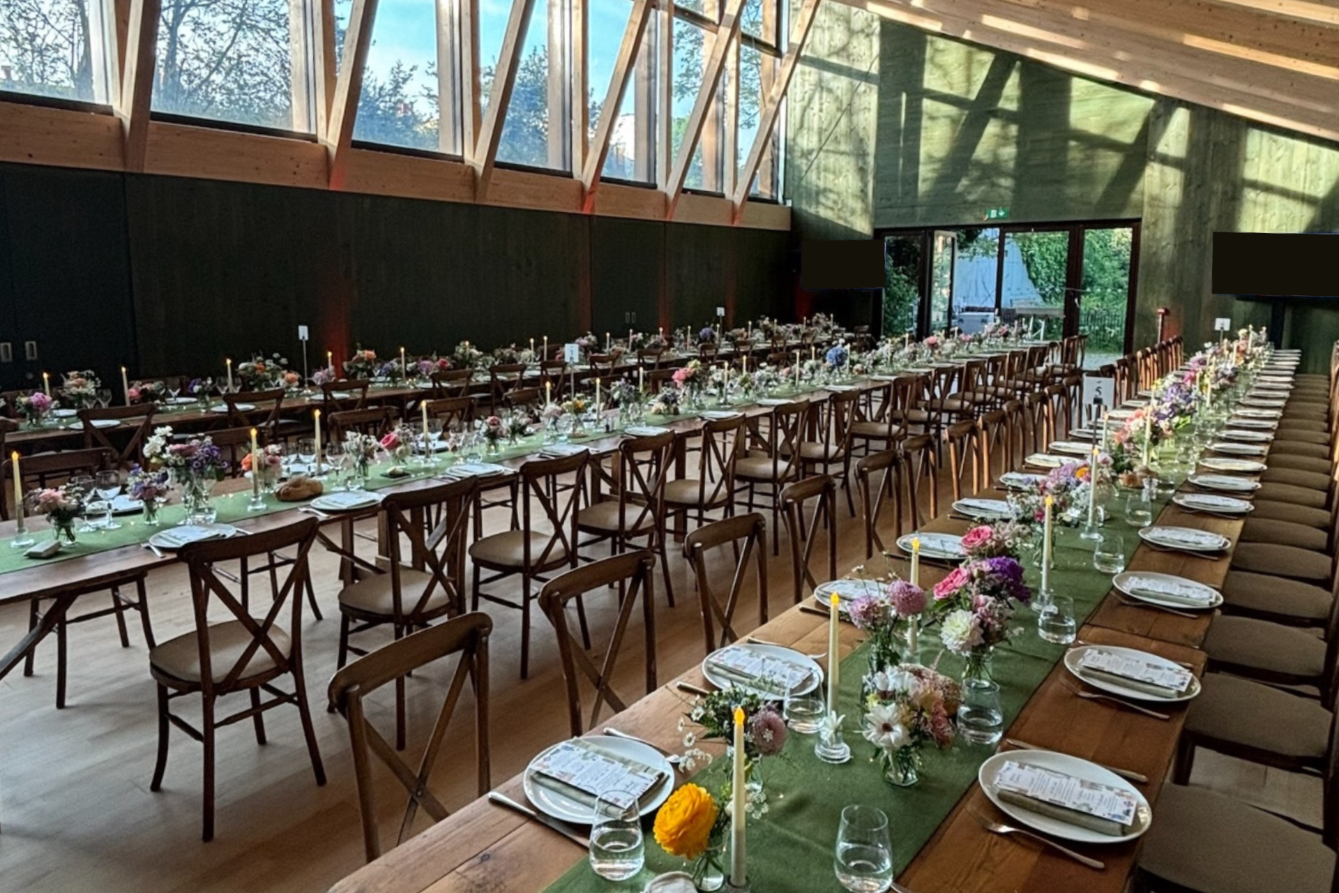 Elegant banquet setup in Sands End's Main Hall with floral centerpieces for events.