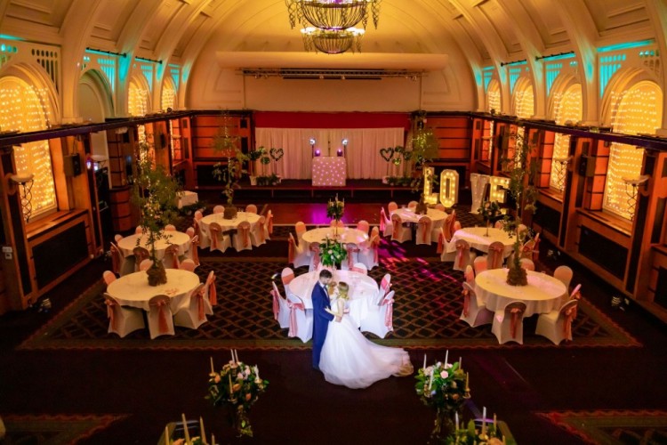 Wedding reception in Royal Bath Hotel Bournemouth with elegant floral decor and soft lighting.