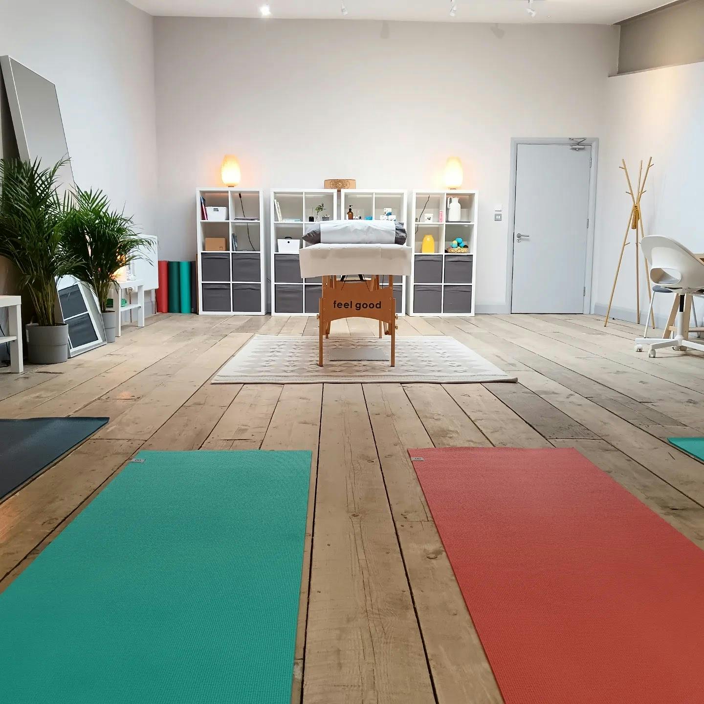 Serene wellness treatment room with yoga mats, ideal for retreats and workshops.