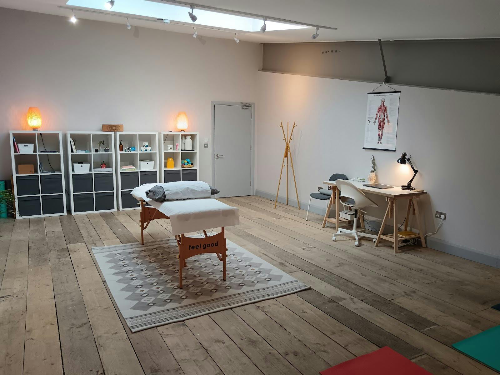 Serene treatment room with massage table for wellness events and workshops.